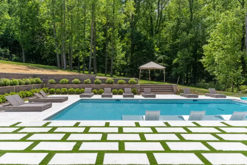 Stylish patio featuring Crema Winter Marble Pavers by Elegance, ideal for upscale homes in New York and surrounding regions.