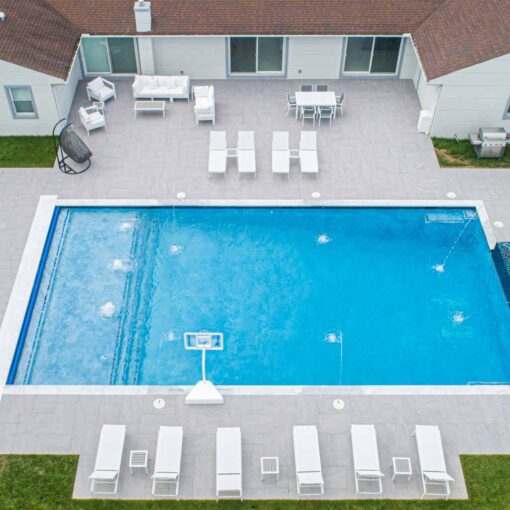 Luxurious poolside design featuring Light Grey Porcelain Tiles by Elegance, enhancing properties in Hawthorne, NJ, and the East Coast.