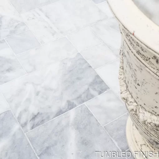 Close-up of Afyon Ice Marble Tumbled tiles from Elegance in New Jersey, showcasing cool, icy tones.