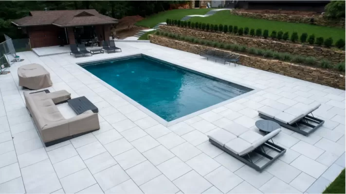 Pool deck porcelain pavers and marble copings