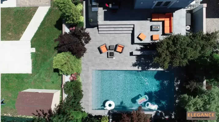 Metal porcelain pavers the backyard of house with pool