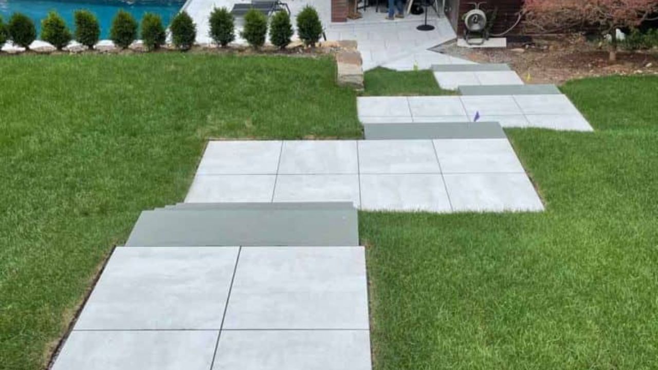 Porcelain Pavers in a Wide-Spaced Stepping Layout Walkway Paver Ideas
