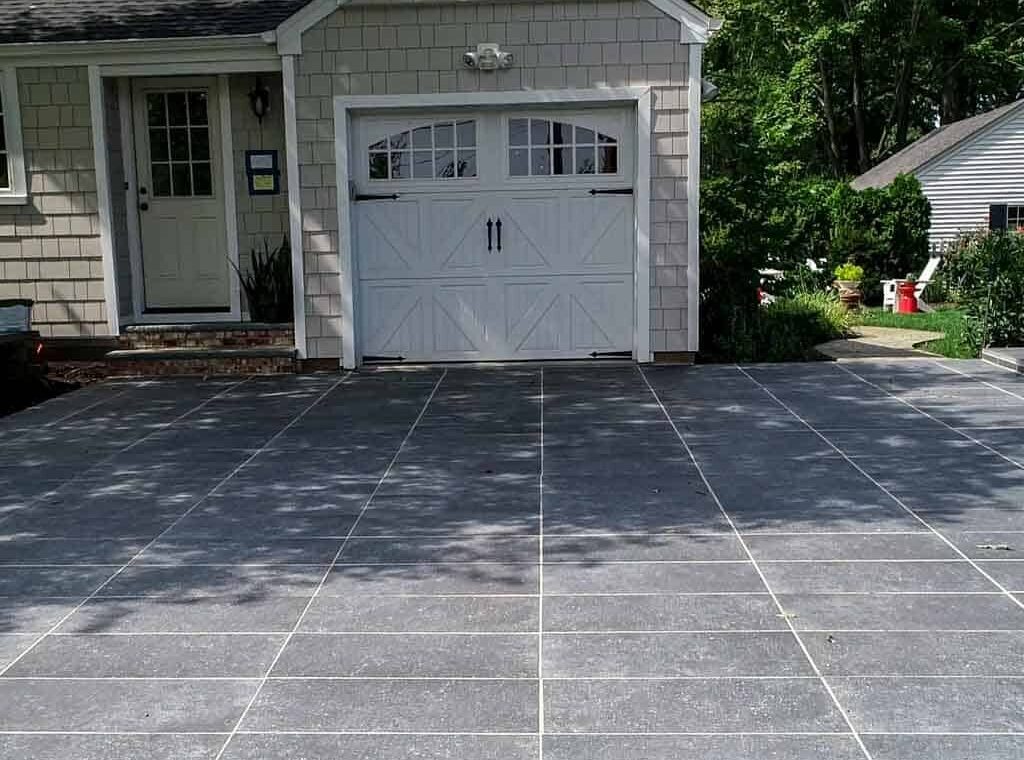 Porcelain driveway pavers framed by defined border edges
