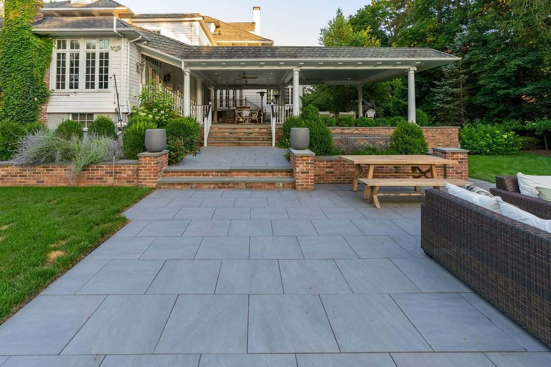 10 Large Format Paver Designs That Make Small Spaces Look Bigger https://ntpavers.com/wp-content/uploads/2026/07/Large-Light-Grey-Porcelain-Pavers-Front-Porch-Without-Borders.jpg