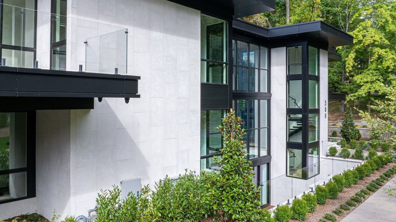 Modern limestone retaining wall with premium landscaping and contemporary home design