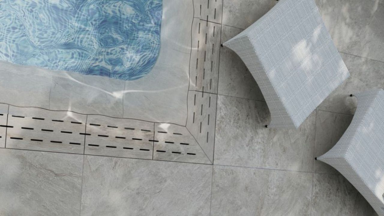 Modern porcelain pool coping design with square edge around a contemporary swimming pool in 2026